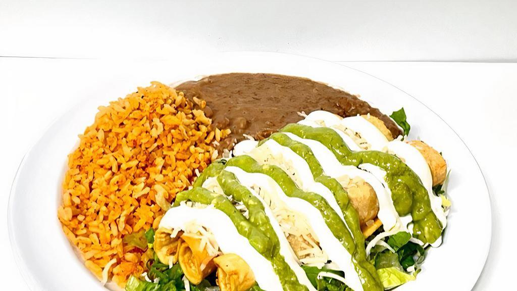  Flautas Plate · 3 chicken flautas topped with lettuce sour cream guacamole and cheese. Served with rice and refried beans