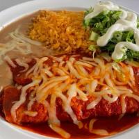 Meat Enchiladas Plate · 2 meat enchiladas, RED or GREEN, lettuce, sour cream, cheese, served with rice and refried b...