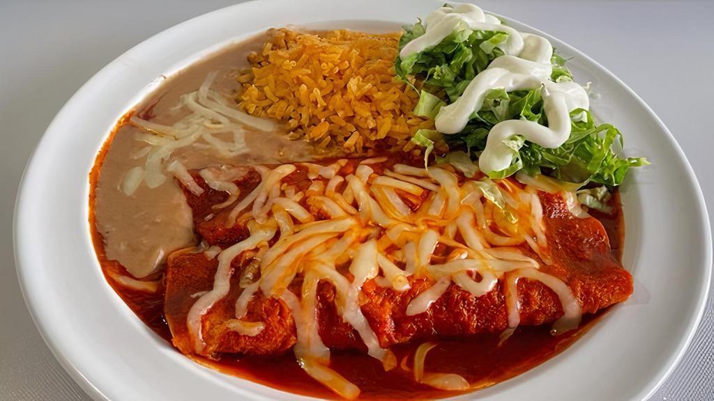 Meat Enchiladas Plate · 2 meat enchiladas, RED or GREEN, lettuce, sour cream, cheese, served with rice and refried beans