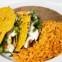 Super Crispy Taco Plate · 2 super crispy tacos, rice and refried beans