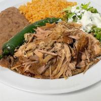 Carnitas Plate · Carnitas, grilled serrano peppers, lettuce, sour cream, rice, refried beans, and 4 tortillas