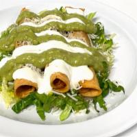 Flautas · 3 chicken flautas topped with lettuce sour cream & guacamole