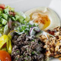 Mix Gyro Plate Chicken And Beef Plate · Thinly carved marinate chicken & beef cooked on a vertical broiler served with rice, hummus,...