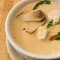 Tom Kah Kai · Chicken and mushrooms in spicy coconut soup.