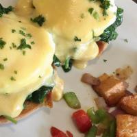 Eggs Florentine · Sautéed spinach and garlic, two poached eggs and hollandaise sauce served on a toasted Engli...