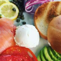 Lox & Bagel · Bagel and cream cheese with sliced tomatoes, onions, capers, avocado, cucumbers and smoked s...