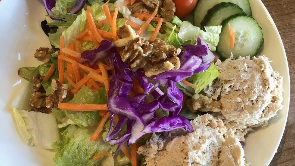 Albacore Tuna Salad · Albacore salad on a bed of romaine and mixed greens with tomatoes, cucumbers, carrots and walnuts.