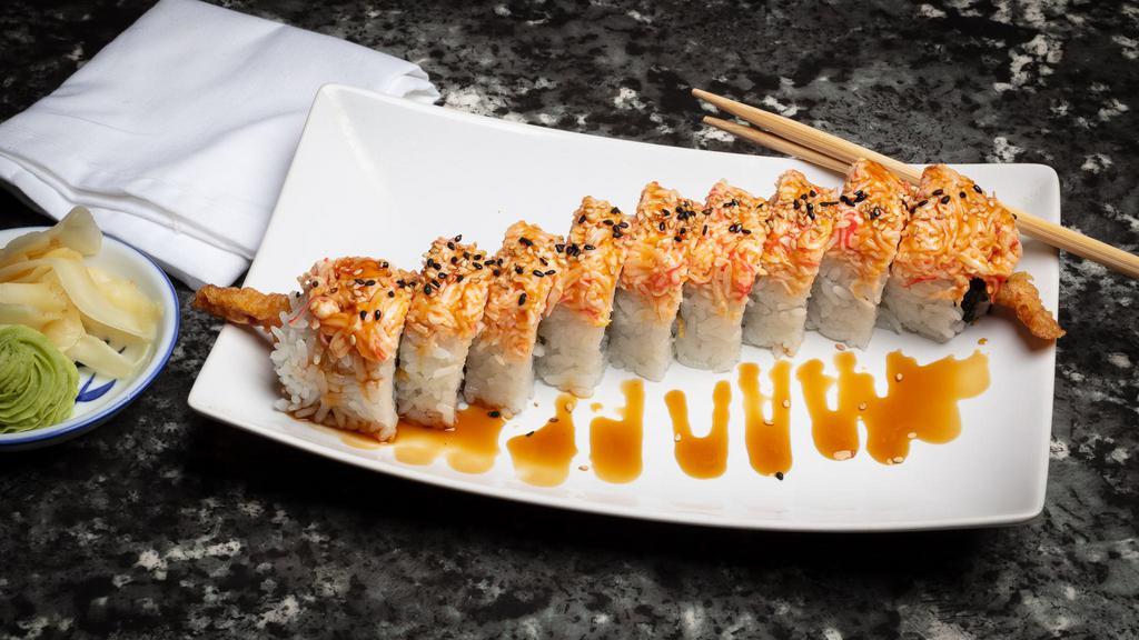 Tigger Roll · Crispy shrimp tempura and cucumber topped with spicy crab and teriyaki sauce.