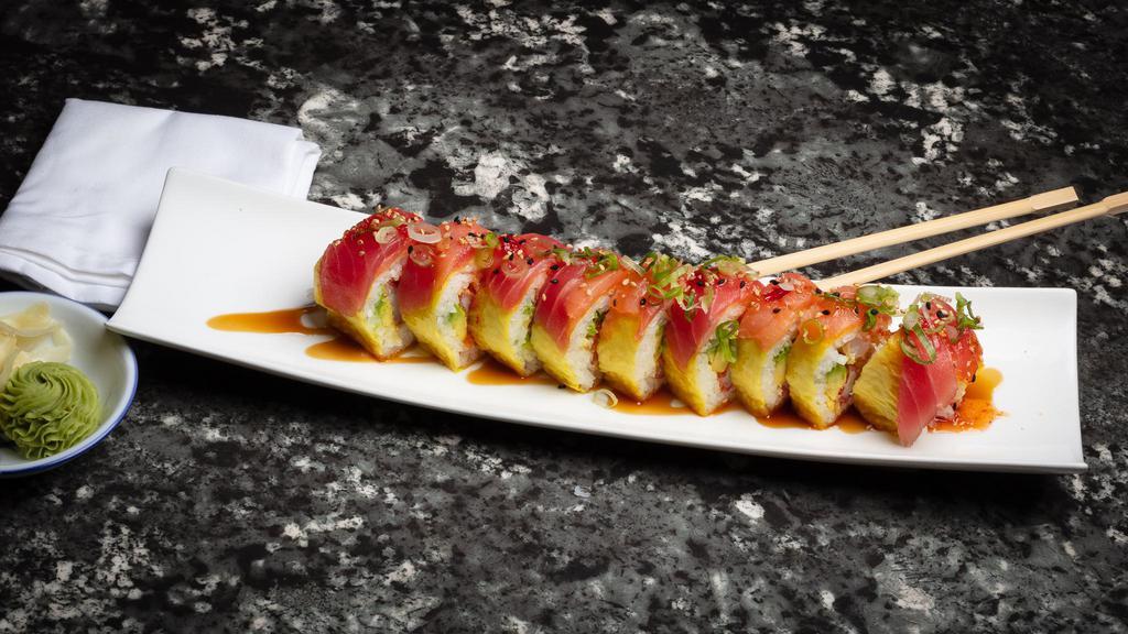 Iron Man Roll · Tempura shrimp and crab with avocado rolled in soy paper topped with tuna and smoke salmon drizzled with special sauce.