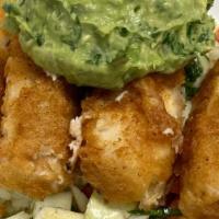 Fish Rice Bowl · Rice, cabbage, cilantro, tomato, avocado,  topped with beer battered deep fried Ono fish, si...