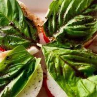 Caprese · Sliced tomatoes, fresh mozzarella cheese, basil, balsamic dressing