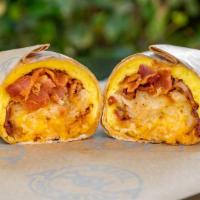 Basic Burrito W/Meat · Prepared with 3 scrambled eggs, hash browns, cheese, and salsa, and your choice of one prote...