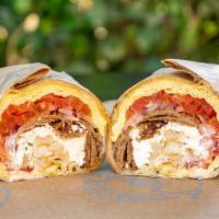 Greek Breakfast Burrito · Prepared with 3 scrambled eggs, Choice of protien, Feta cheese, Roma tomatoes, Red onions, H...