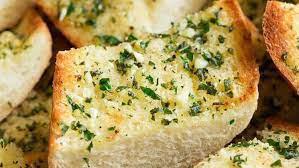 Garlic Bread · Fresh bread covered in garlic and butter.