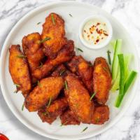 Classic Crispy Wings · Fresh chicken wings breaded and fried until golden brown. Served with a side of ranch or ble...