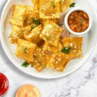 Fried Ravioli · Cheese-filled ravioli, breaded and fried until golden brown. Served with housemade marinara ...