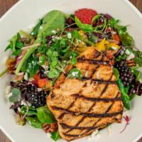 Grilled Salmon Salad · Contains nuts. Scottish salmon, organic greens, fresh berries, candied pecans, queso, mango-...