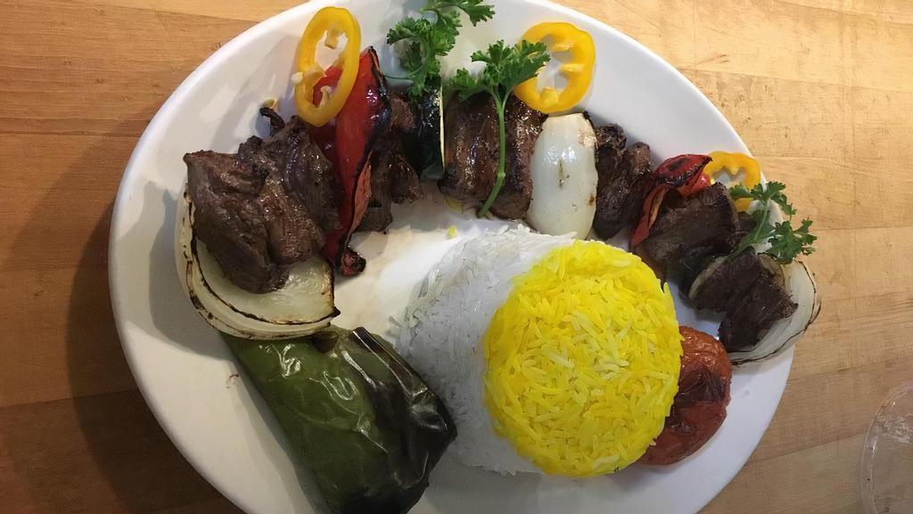Shish Kabob · Succulent chucks of filet mignon marinated and barbecued with onions & bell peppers. (Served with basmati rice, BBQ tomato and pepper).