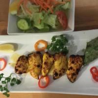 Chicken Salad · Succulent pieces of chicken tender marinated and barbecued. Served with a side of salad (let...