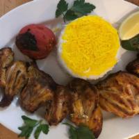 Bone In Chicken Kabob (Cornish Game Hen) · Skewered, marinated and barbecued Cornish game hen served with basmati rice, BBQ tomato and ...