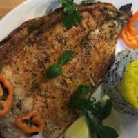 Rainbow Trout · Fresh rainbow trout seasoned and served with sabzi polo (green herb rice) BBQ tomato and pep...