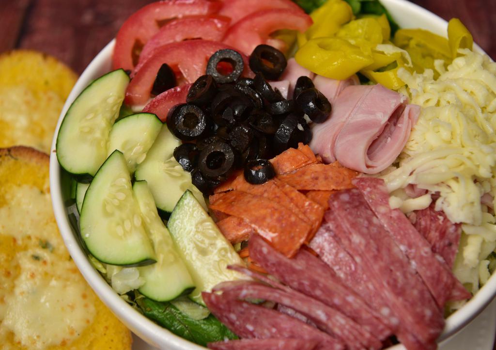 Antipasto Salad · Tomatoes, homemade mozzarella, provolone, roasted peppers, fresh artichoke hearts, imported olives, string beans, sun-dried tomatoes and grilled eggplant, zucchini and carrots.