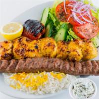 Chicken & Koobideh Combo Plate · Combination of one boneless chicken kabob and one ground beef koobideh kabob, served with im...