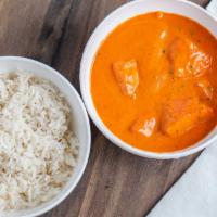Chicken Tikka Masala · Marinated boneless chicken breast cooked in tandoor then delicately cooked with spices.