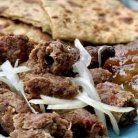 Shish Kebab · Minced ground meat, sausage shaped, mixed with onions, ginger, garlic and spices.