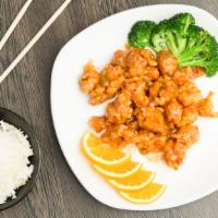 Orange Chicken · Crispy breaded chicken, glazed with a sweet tangy orange sauce. Served with steamed rice, wh...