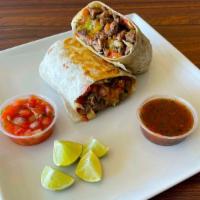 Ultimate Burrito · Choice of meat.With  jack & cheddar cheese, delicious Pico de Gallo, and fresh hand-made gua...