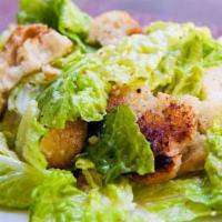Caesar Salad · Torn hearts of Romaine tossed with Caesar dressing, shaved parmesan cheese, and garlic crout...