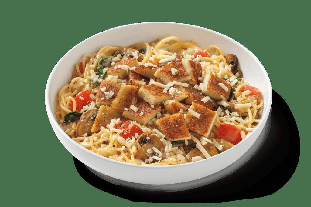 Alfredo Montamore® With Parmesan-Crusted Chicken · Spaghetti noodles in four-cheese blend alfredo, roasted mushrooms, tomato, spinach and parmesan-crusted chicken topped with MontAmore cheese and cracked pepper.