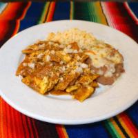 Chilaquiles · Corn tortillas, onions, parmesan cheese and scrambled eggs. Covered with salsa roja