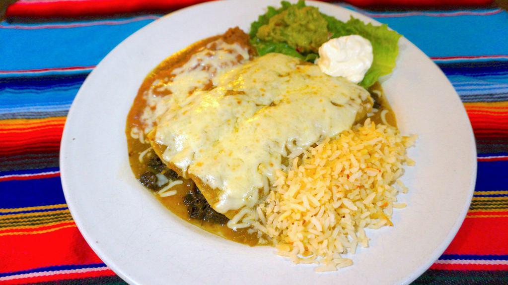 Andrea'S Special · Spinach enchiladas covered with a green tomato sauce. Served with rice and beans