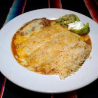 Enchiladas Rancheras · Served with Guacamole, rice and beans
