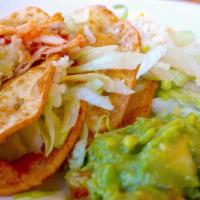 Potato Tacos · 2 Tacos with mashed potatoes inside. Served with refried beans and rice.