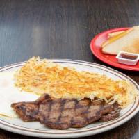 Steak & Eggs
 · 2 pieces of grilled steak. Served with 3 eggs, fresh hash browns, and toast.