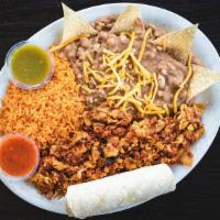 Chorizo & Eggs · Scrambled eggs and pork chorizo served with our fresh Mexican rice, refried beans, and torti...