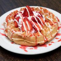 Strawberry Waffle · Belgian waffle topped with fresh strawberries, sweet cheesecake cream, strawberry glaze, whi...