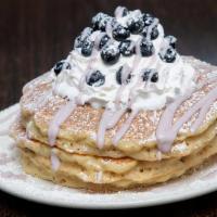 Blueberry Pancakes · 3 pancakes topped with fresh blueberries, sweet cheesecake cream, Smucker's blueberry syrup,...