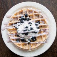 Blueberry Waffle · Belgian waffle topped with fresh blueberries, sweet cheesecake cream, Smucker's blueberry sy...