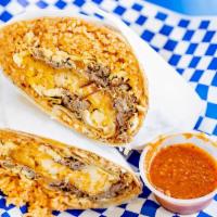 Machaca Breakfast Burrito · Shredded beef, eggs, fresh Mexican rice, refried beans, grilled onions and bell peppers, and...
