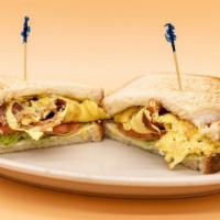 Bacon And Egg Sandwich · Crispy bacon, eggs, lettuce, tomato, and mayo on the toast of your choice.