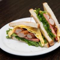 Sausage And Egg Sandwich · Sausage, eggs, lettuce, tomato, and mayo on the toast of your choice.
