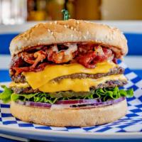 Double Colossal Cheeseburger · Sesame seed bun, 2 hamburger patties, 2 slices of melted American cheese, juicy pastrami, le...