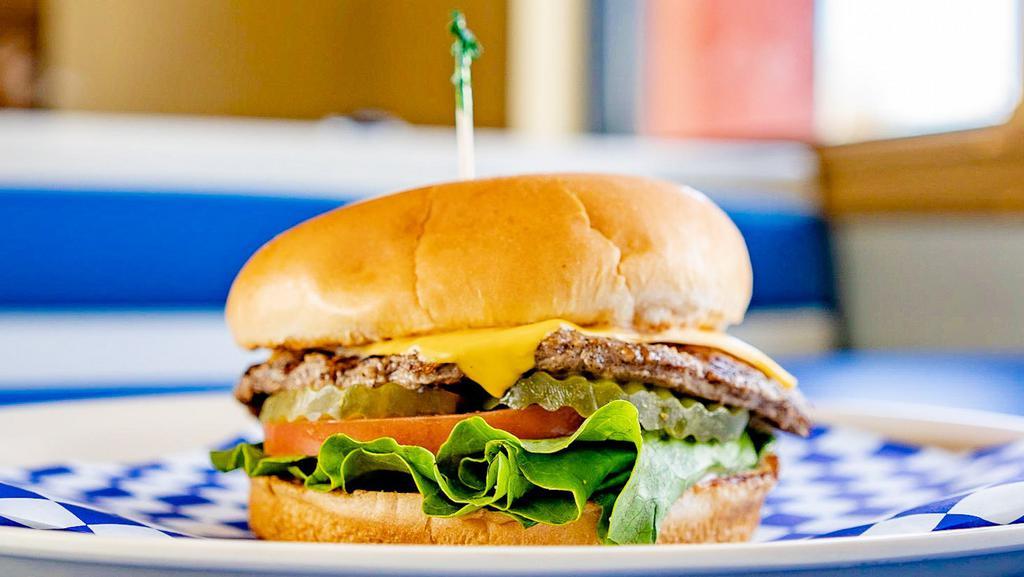 Junior Cheeseburger · Junior bun, hamburger patty, melted American cheese, lettuce, tomato, pickles and our signature 1000 Island dressing. Perfect for kids.