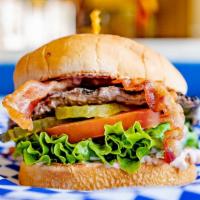 Junior Bacon Burger · Junior bun, hamburger patty, crispy bacon, lettuce, tomato, pickles and our signature 1000 I...