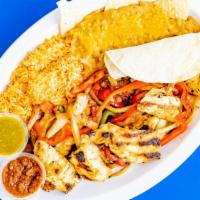 Chicken Fajitas · Grilled chicken breast, red and green bell peppers, onions, and tomatoes. Served with our fr...