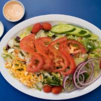 Green Salad · Lettuce, cucumbers, tomatoes, shredded cheddar cheese and red onions.